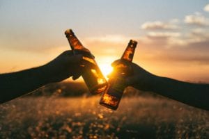 cheers with beer bottles